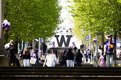 UW Tacoma's grand staircase with people walking outside during Husky Fest in 2026.