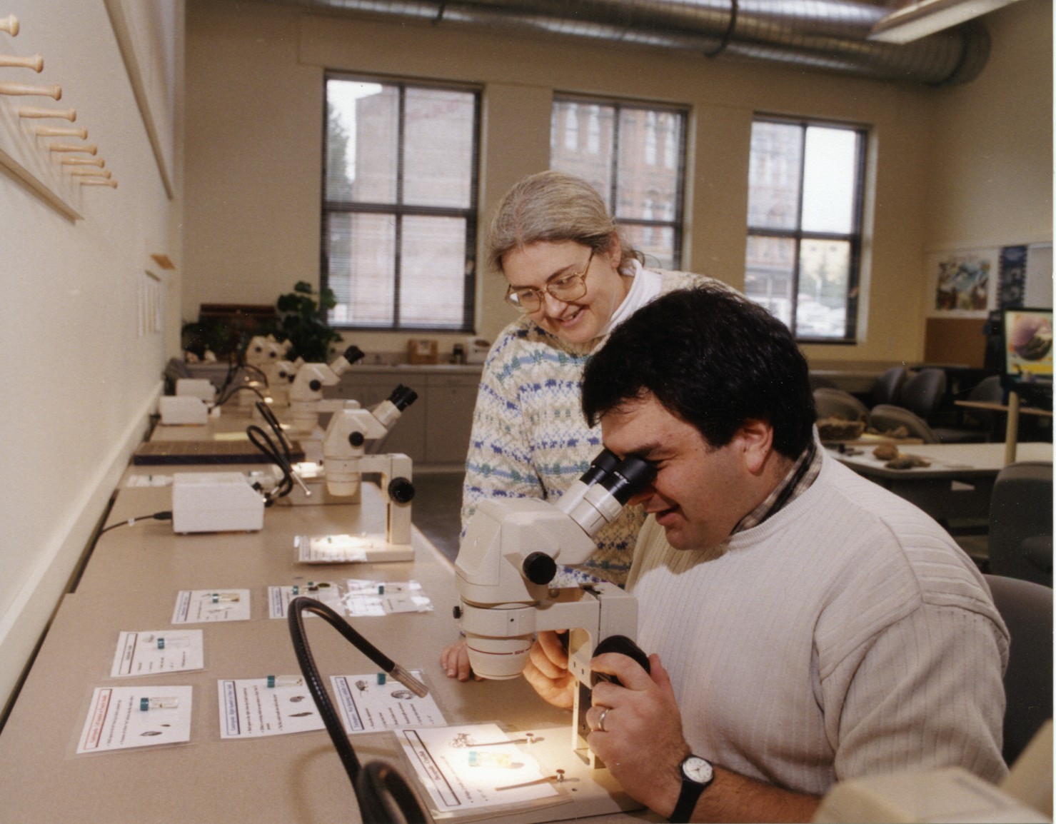 Professors Cheryl Greengrove (center) and David Secord (right) showing off new lab space in the Dougan building addition in 1999.