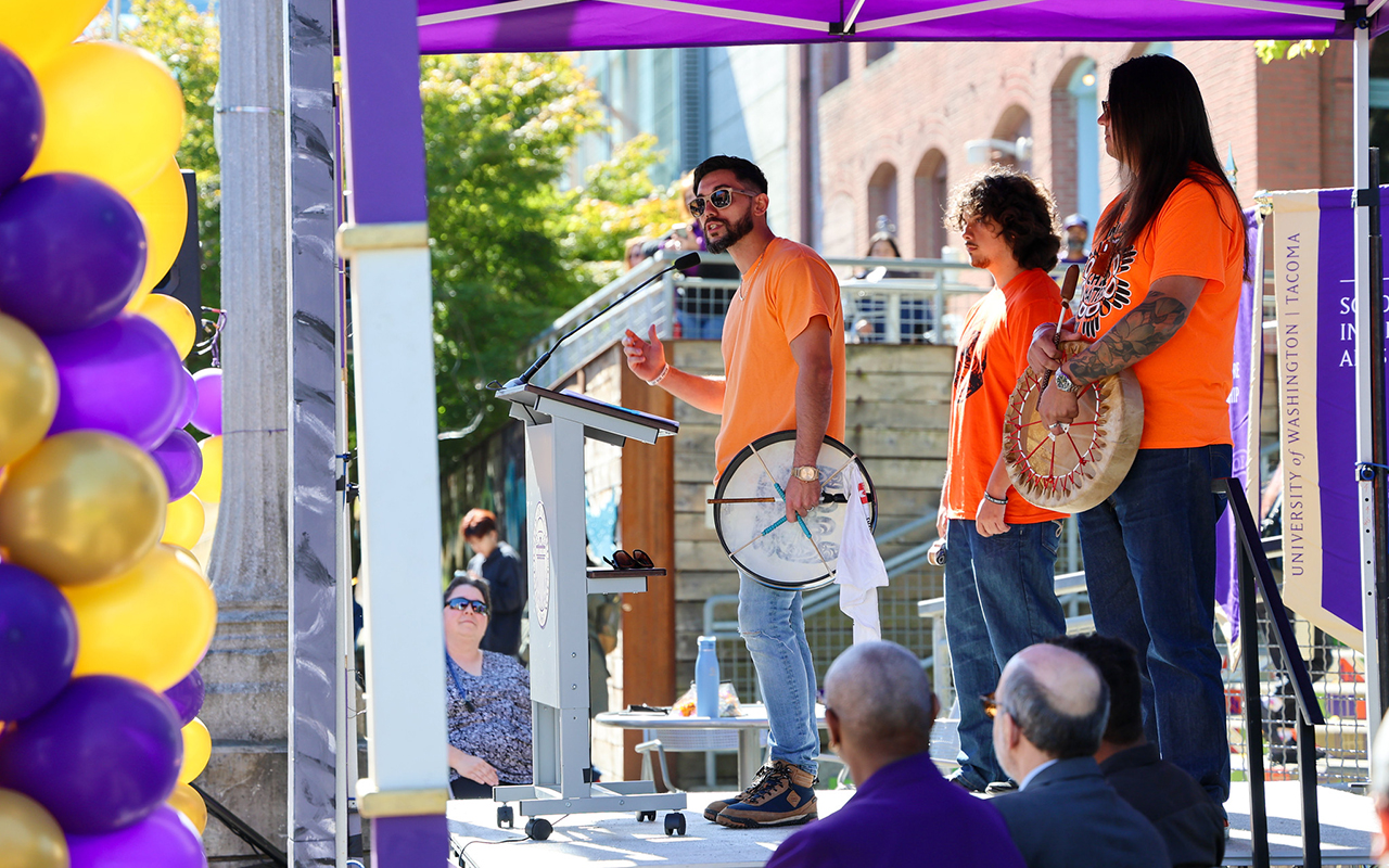 David Sway-La Cougar Duenas speaks at a podium during UW Tacoma Convocation.