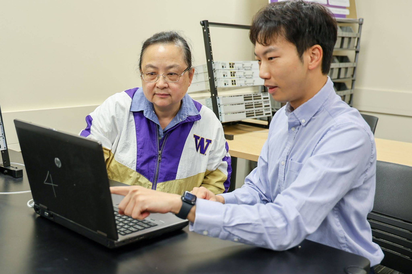 Yan Bai (left) and Zikai Wen (right) collaborate in their lab at UW Tacoma.