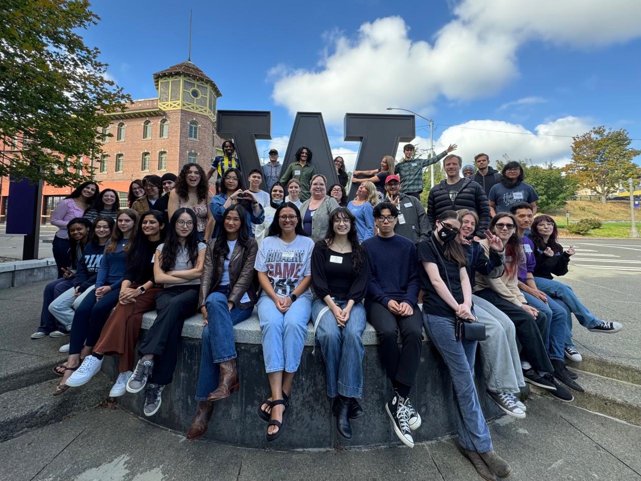 Full TLC Staff posing in front of the W