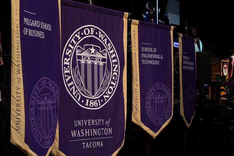 UW Tacoma graduation flags in a line