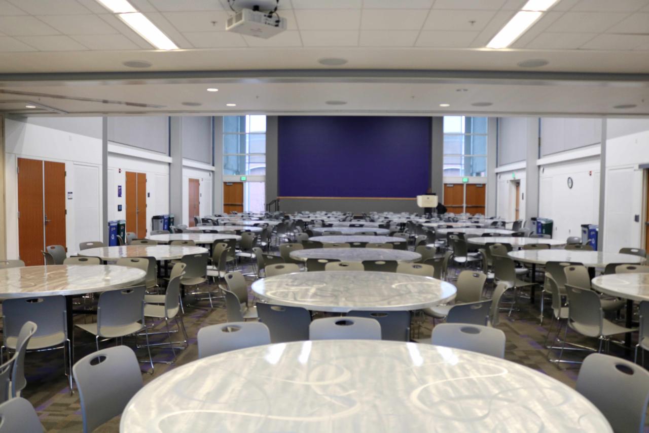 Event space full of round tables with chairs