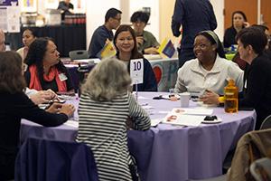 A group of participants gather at a table for roundtable conversations at the inaugural Healthcare Symposium.