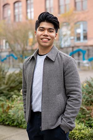 A portrait of UW Tacoma student Michael Allosada on the UW Tacoma campus.