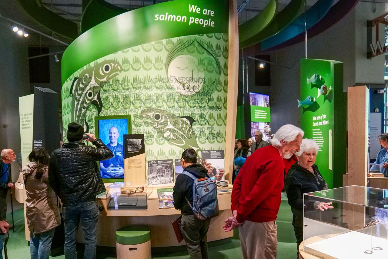 Visitors explore the new "This is Native Land" exhibition at the Washington State History Museum. | Photo courtesy of Washington State History Museum