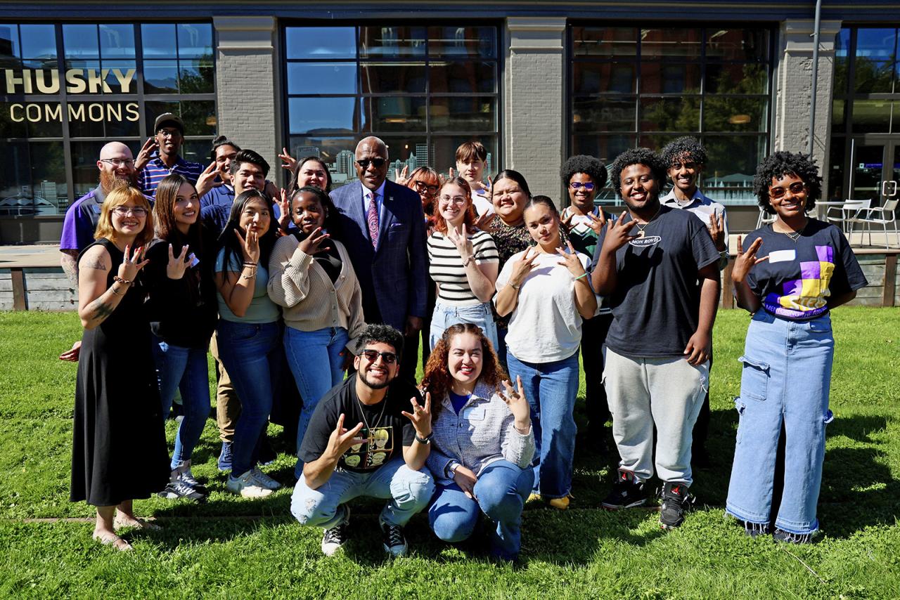 UW President Robert J. Jones takes a group photo with UW Tacoma students during a visit to campus.