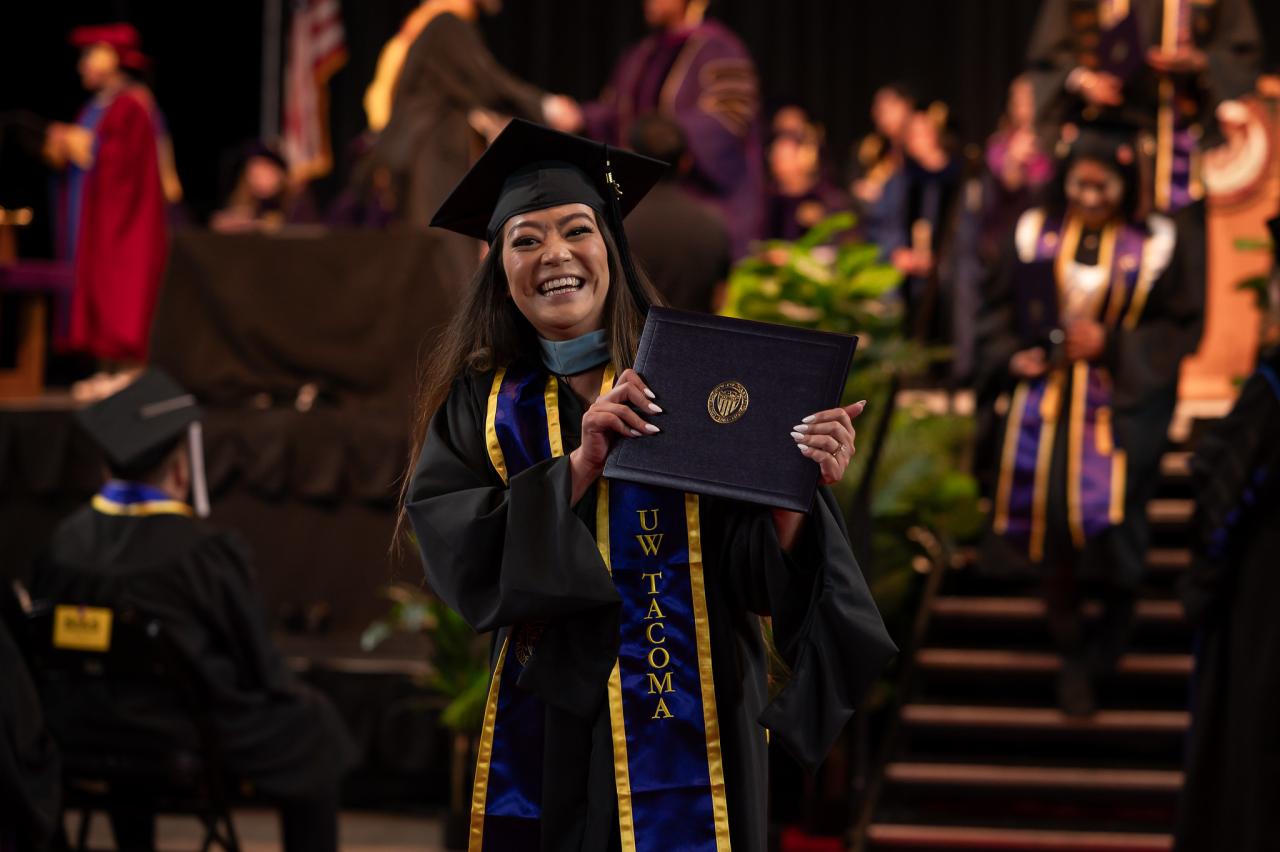 A graduate celebrates earning their degree at UW Tacoma's 35th annual Commencement.
