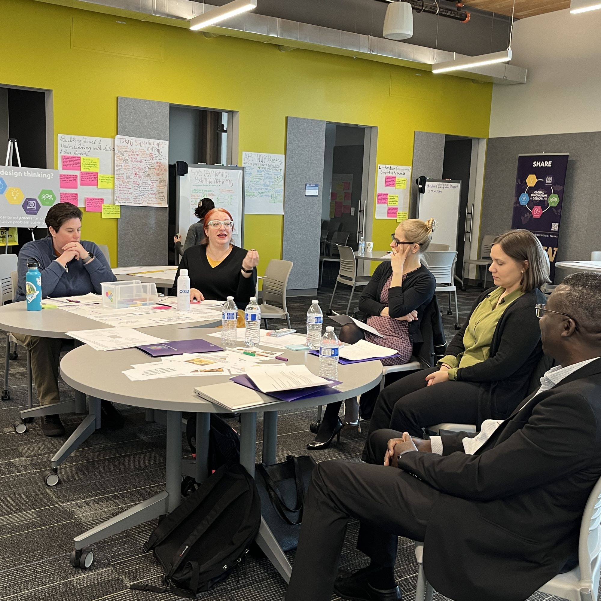 L-R: Sarah Weiss, Christina Winstead, Emma Lacalli, KC Dean, and Isaac Kwakye discuss the purpose of the workplan