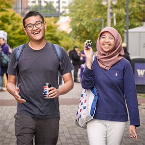 Students smile for a photo on the Prairie Line Trail at UW Tacoma Convocation.