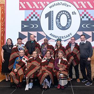 A group photo captured at the 10th anniversary celebration of wǝɫǝbʔaltxʷ - Intellectual House.