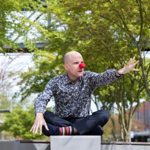 Luke Perone on UW Tacoma campus with a red clown nose