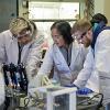 A UW Tacoma faculty member assists students in a chemistry lab.