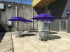 Photo of outdoor UWY Patio showing tables, chairs, and umbrellas.