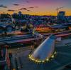 Photo of UW Tacoma at twilight with the Museum of Glass in the foreground