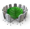 a leaf as a table with office chairs surrounding it. Symbolizes the Sustainability Committee