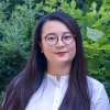 Ping Luarn, an international student from Taiwan, standing in front of greenery