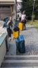 Rachel and another student dragging luggage through a cobblestone street