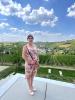 Kecia standing in front of a winery