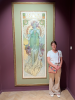 Image of Kecia standing next to tall painting