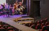 Three men jump off the stage at the Tacoma Little Theatre