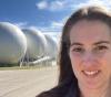 UW Tacoma mechanical engineering student Amy Keller at NASA Langley Research Center in front of vacuum chambers.