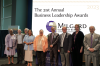 A group photo of the 2023 Business Leadership Awardees on a stage