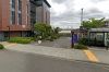 Photo of the entrance of the Tioga hourly parking lot on the UW Tacoma campus.