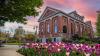 UW Tacoma Snoqualmie building during sunset with purple flowers