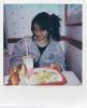 Milla sitting in front of fast food