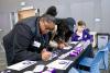 Students complete cards to support first gen students at UW Tacoma