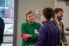 Distinction of Excellence panelist speaks with student at the Clean Energy Panel