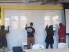 MACP students writing on whiteboard