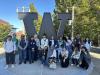 group of new international students in front of the W statue on UWT campus.
