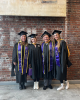 Sage Ahrens-Nichols graduates with classmates and colleagues from the UW Tacoma School of Social Work and Criminal Justice.