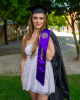 Sage Ahrens-Nichols poses for graduation photos with her U.S. Army stole. 