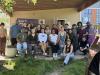 Photo of people grouped at the giving garden