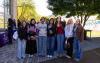 A group of students pose for a group photo along UW Tacoma's Prairie Line Trail.