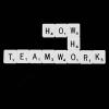 scrabble tiles spell out How Who Teamwork