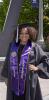 Photo of student in graduation attire and military recognition stole