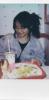 Milla sitting in front of fast food